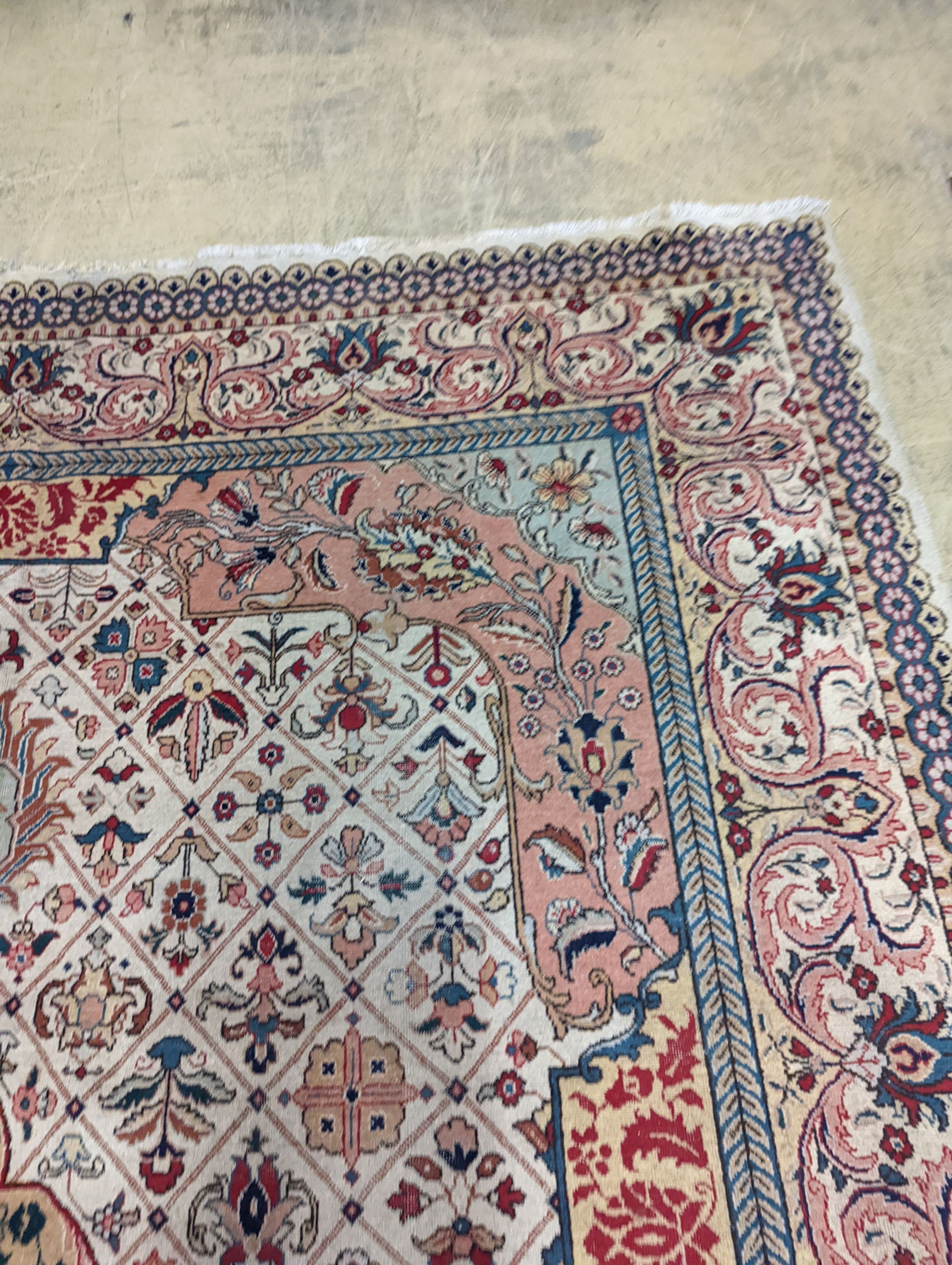 A Tabriz ivory ground carpet, 425 x 306cm